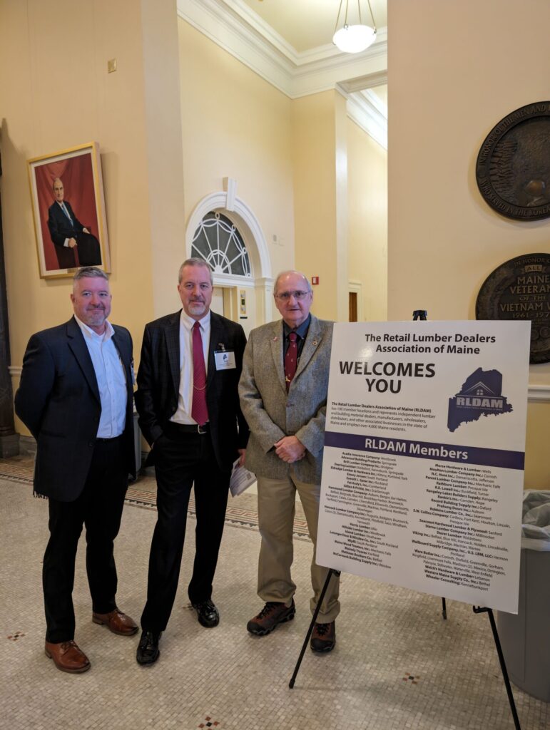 RLDAM Legislative Chair, Rod Wiles of Hammond Lumber Co. (Center), Martin Wiles of Wolf Home Products (Left) and Maine State Representative Larry Dunphey (Right)