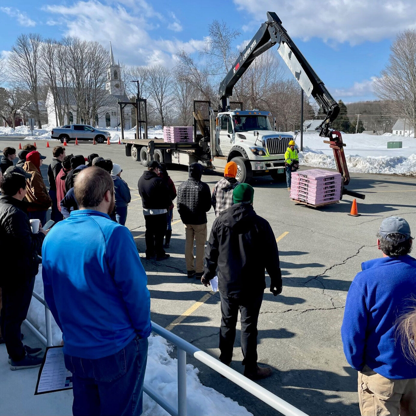 Students watch a truck hoisting demo outside of Bright Futures 2023