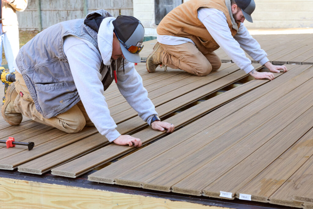 Construction workers building a deck